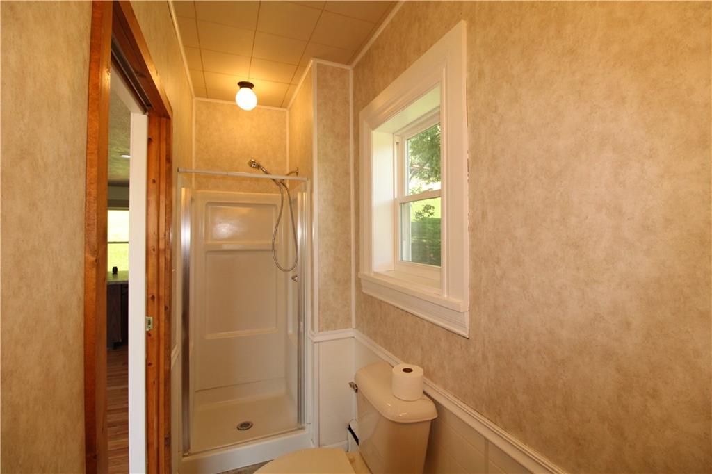 5286 Pollock Road Marion Center, PA 15759 - Photo 12 of 21 a bathroom with a granite countertop sink a toilet and shower