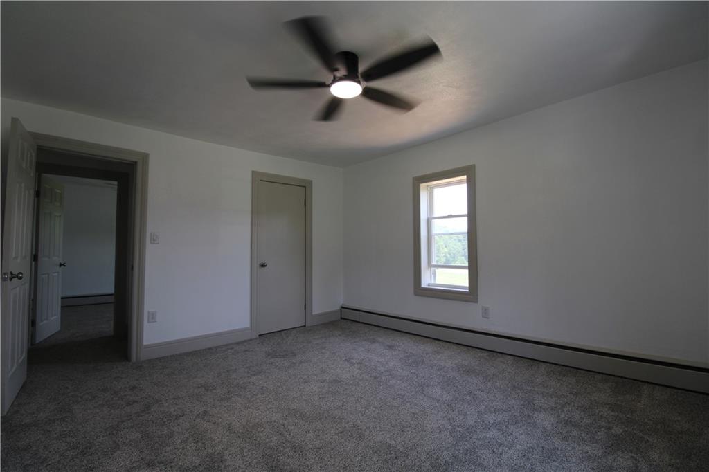5286 Pollock Road Marion Center, PA 15759 - Photo 15 of 21 an empty room with ceiling fan and window