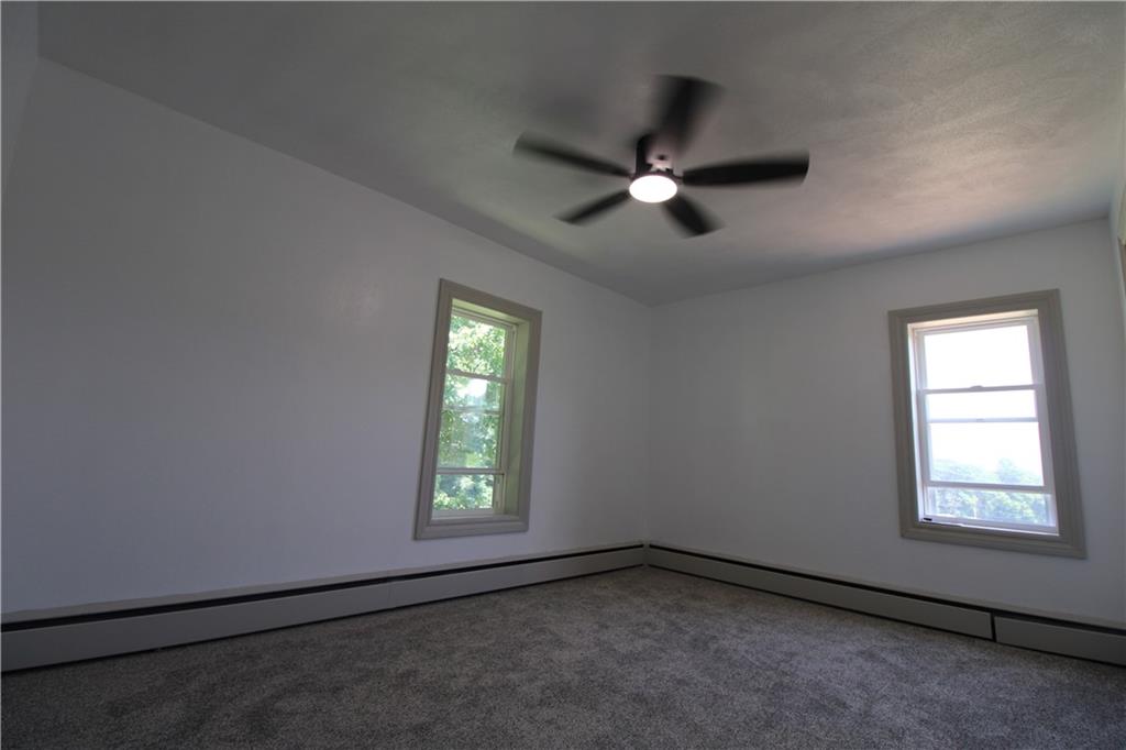 5286 Pollock Road Marion Center, PA 15759 - Photo 16 of 21 an empty room with windows and fan