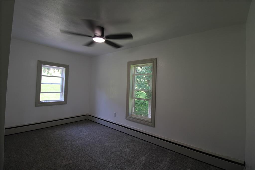 5286 Pollock Road Marion Center, PA 15759 - Photo 17 of 21 an empty room with a window and a fan