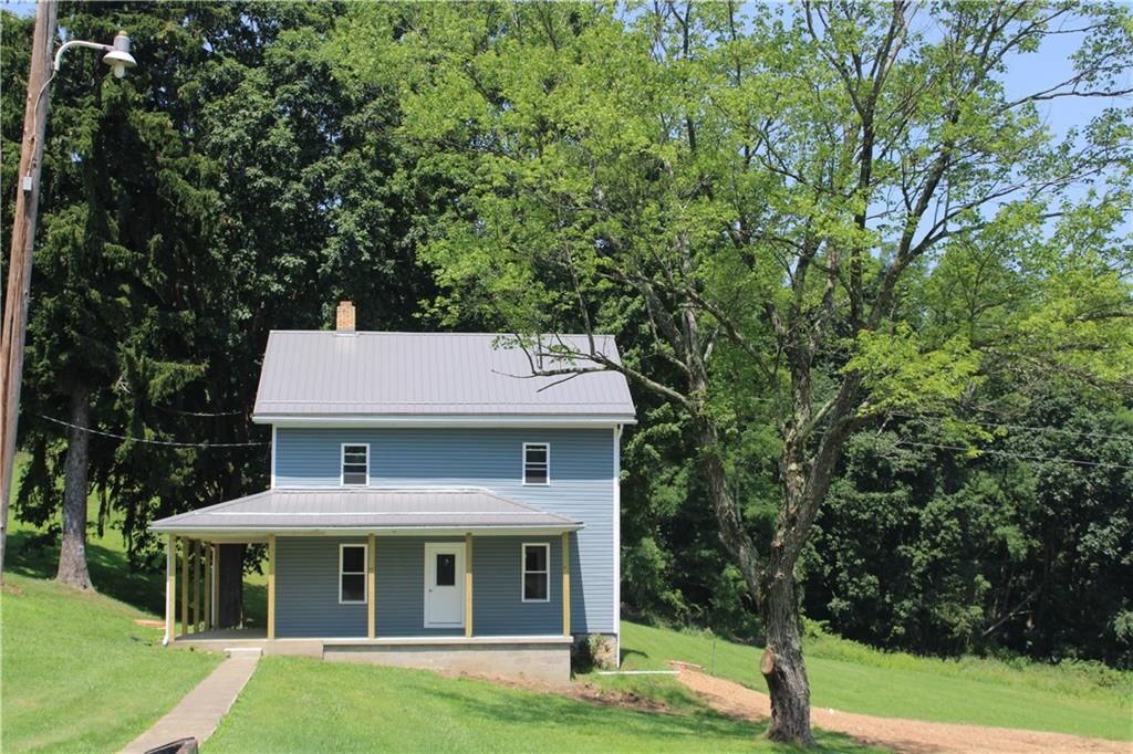 5286 Pollock Road Marion Center, PA 15759 - Photo 2 of 21 a front view of a house with a garden