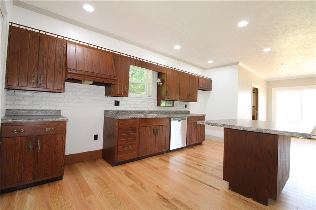5286 Pollock Road Marion Center, PA 15759 - Photo 6 of 21 a large kitchen with a large counter top space a sink stainless steel appliances and cabinets