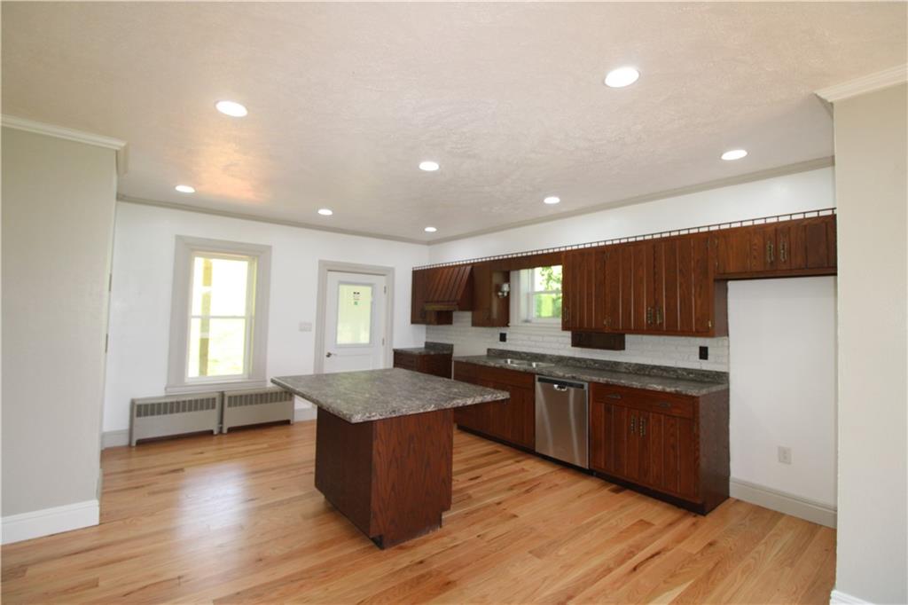 5286 Pollock Road Marion Center, PA 15759 - Photo 7 of 21 a kitchen with stainless steel appliances granite countertop wooden cabinets a sink and a center island