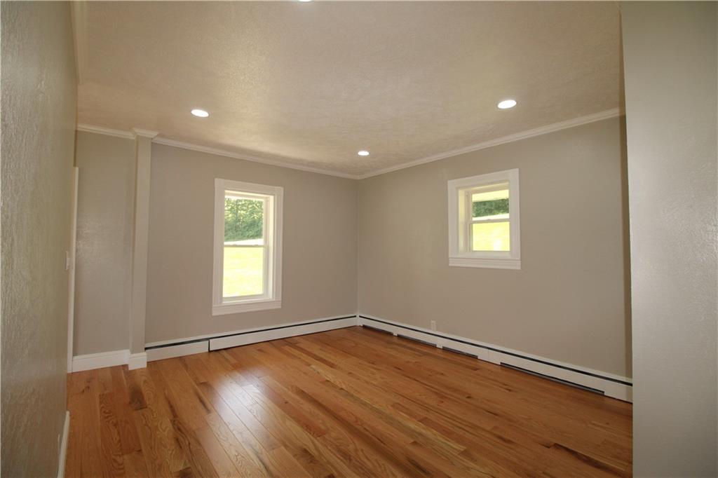 5286 Pollock Road Marion Center, PA 15759 - Photo 9 of 21 a view of empty room with wooden floor and fan