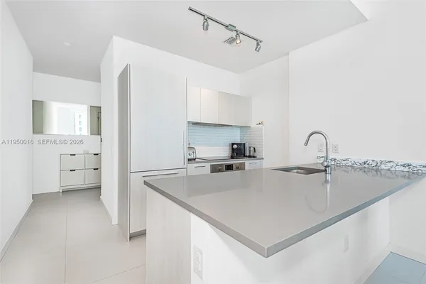 a view of a kitchen with sink