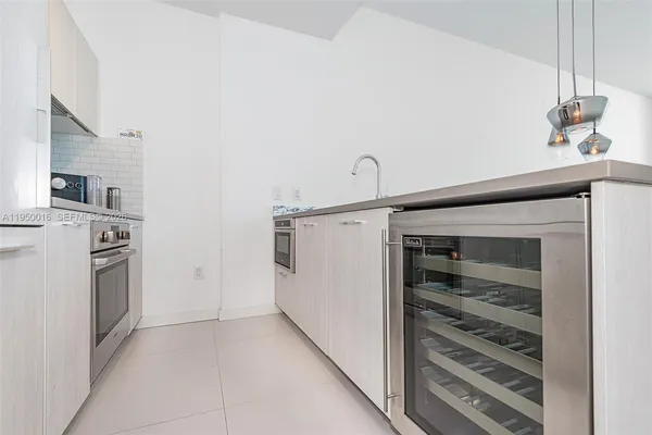 a view of a storage and utility room with washer and dryer
