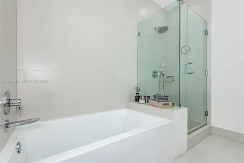 a bathroom with a bathtub and a sink