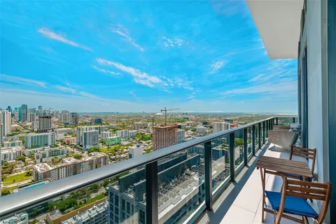 a view of a city from a balcony with city view