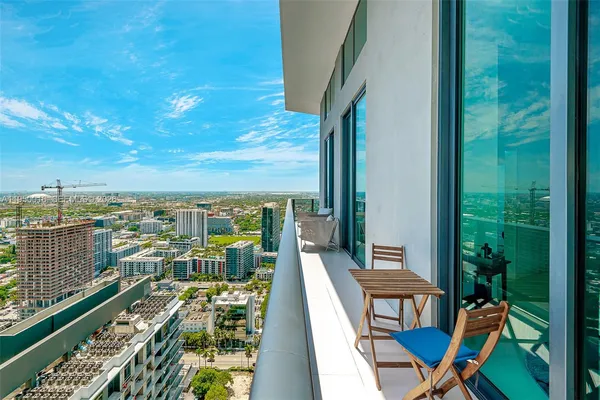 a view of balcony with furniture