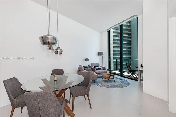 a dining room with furniture and window