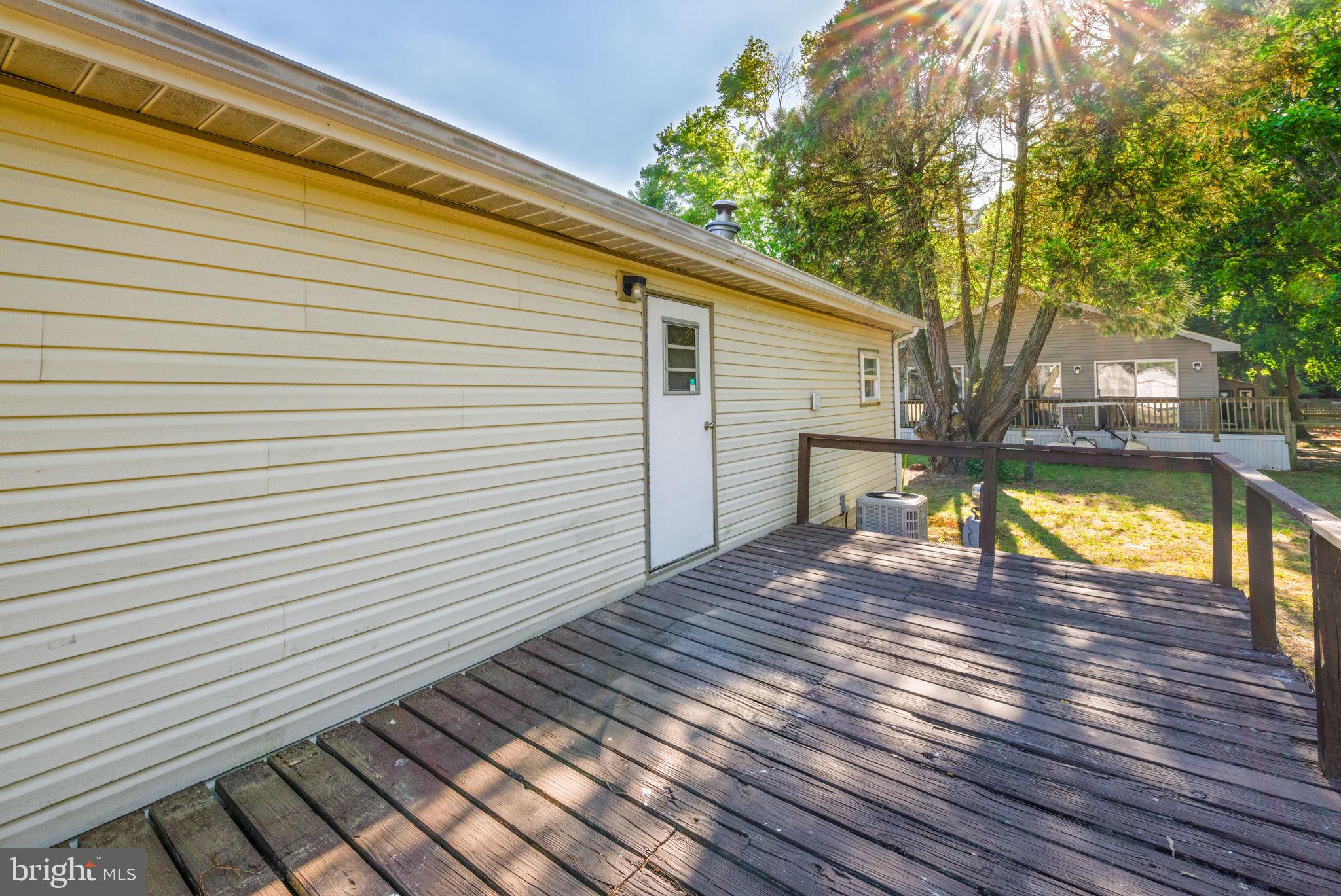 35401 Mallard Road Millsboro, DE 19966 - Photo 19 of 23 a view of a backyard with a patio