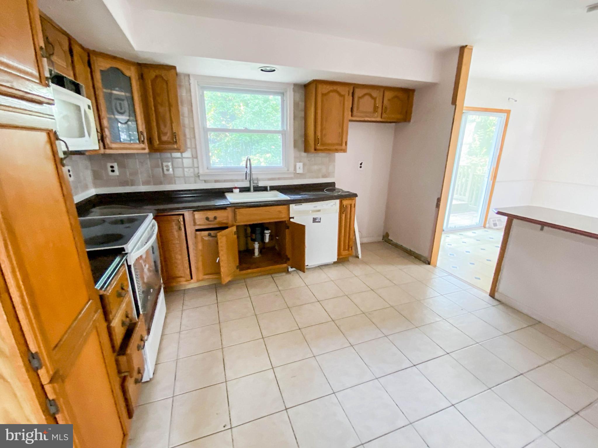 206 Chestnut Avenue Media, PA 19063 - Photo 11 of 33 a kitchen with stainless steel appliances a sink stove and cabinets