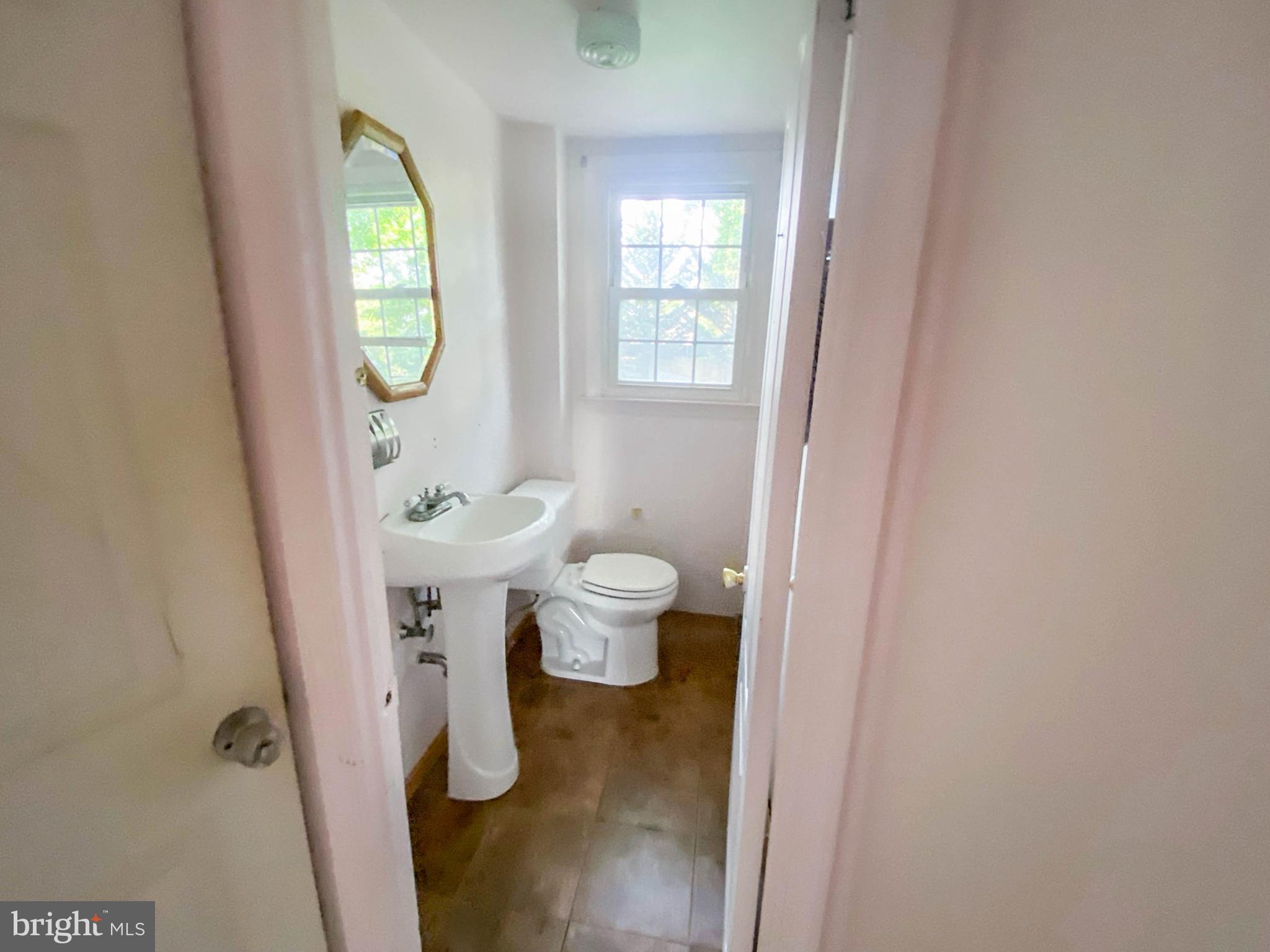 206 Chestnut Avenue Media, PA 19063 - Photo 14 of 33 a bathroom with a toilet sink and a mirror