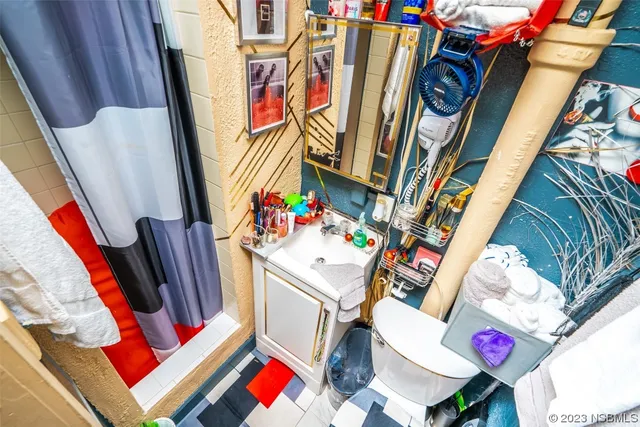 a white refrigerator freezer sitting inside of a kitchen