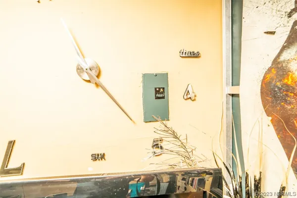 a view of a room with chairs and wooden floor