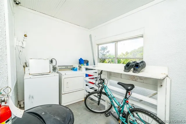 an aerial view of a houses with a lake