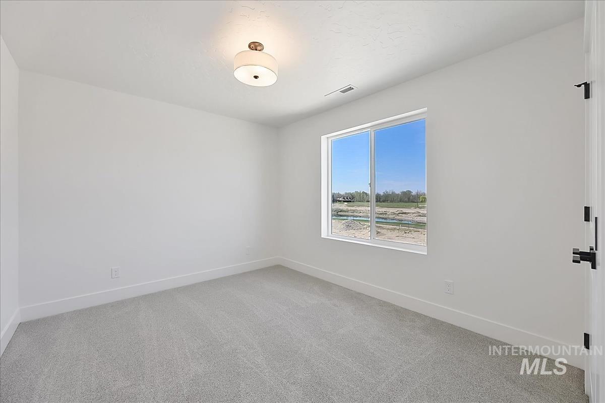 776 South Calhoun Lane Star, ID 83669 - Photo 34 of 49 Neutral-toned carpeting paired with white walls