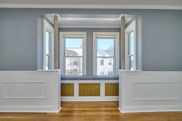 a view of kitchen with furniture and refrigerator