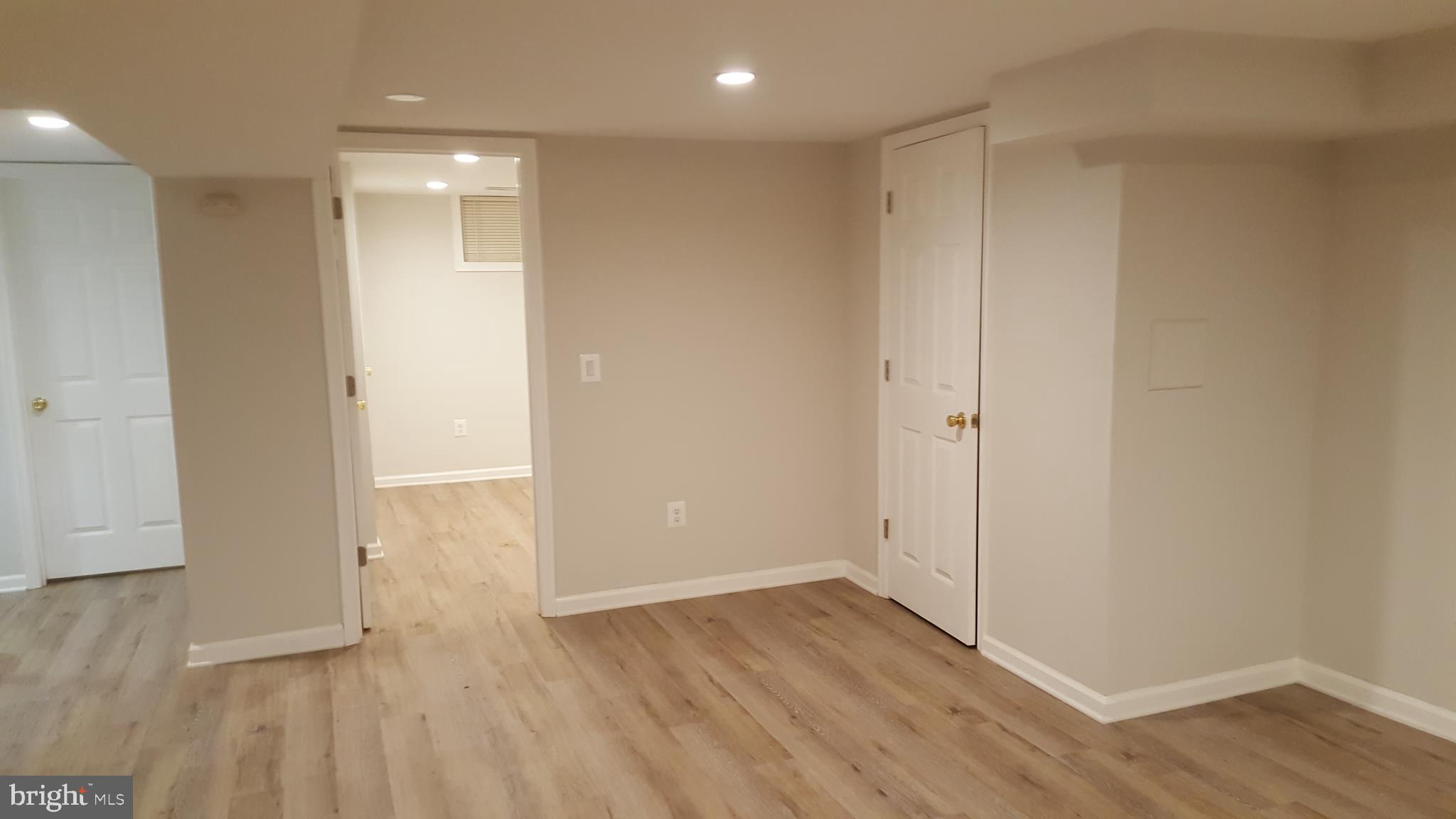 11102 Bucknell Drive Silver Spring, MD 20902 - Photo 12 of 14 a view of an empty room with wooden floor
