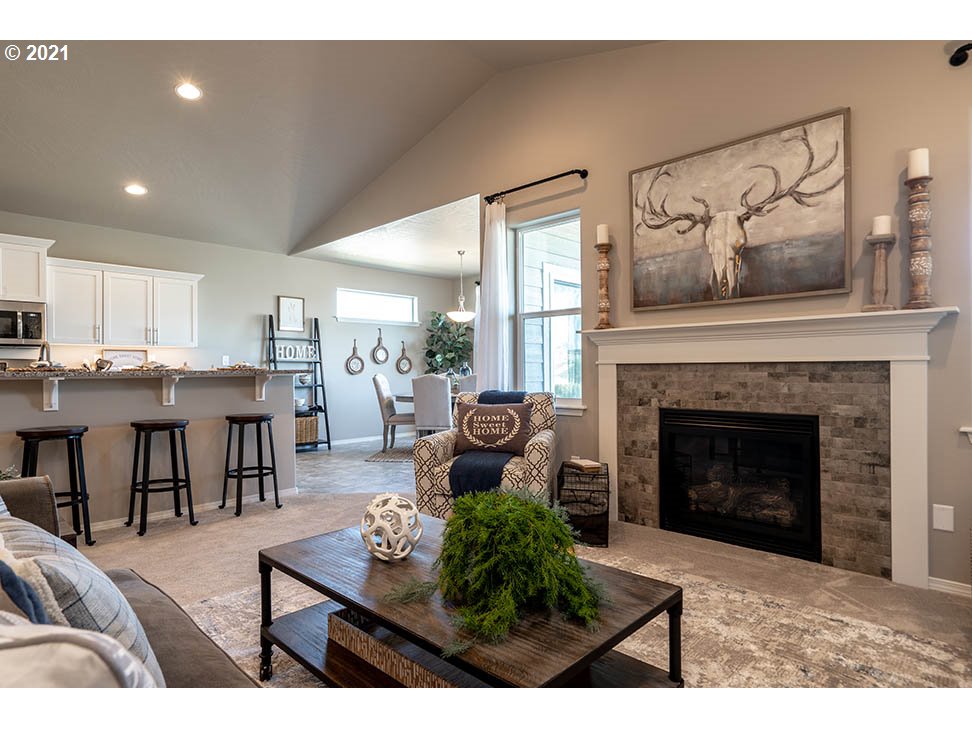 722 South 53rd Street Springfield, OR 97478 - Photo 3 of 11 a living room with furniture and a fireplace