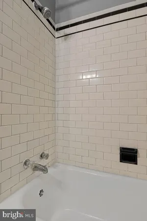 a bathroom with a shower and a bathtub