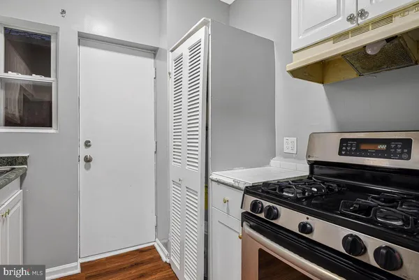 a kitchen with a stove and a microwave