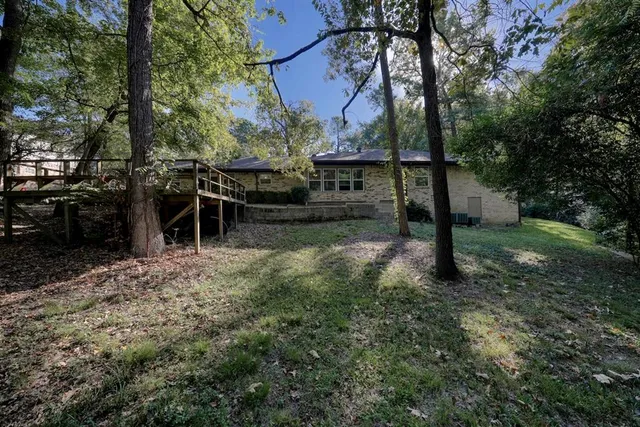 a backyard of a house with lots of green space