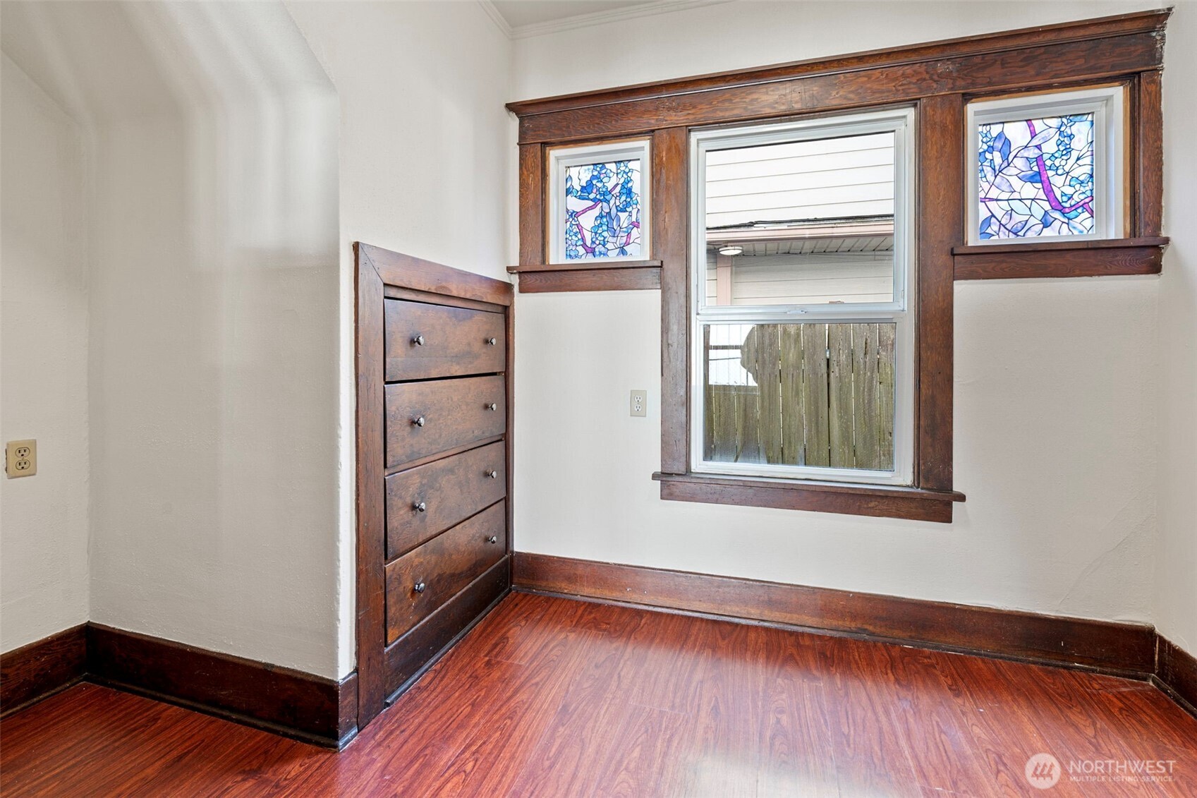 4512 South M Street Tacoma, WA 98418 - Photo 13 of 24 a view of an empty room with wooden floor and a window