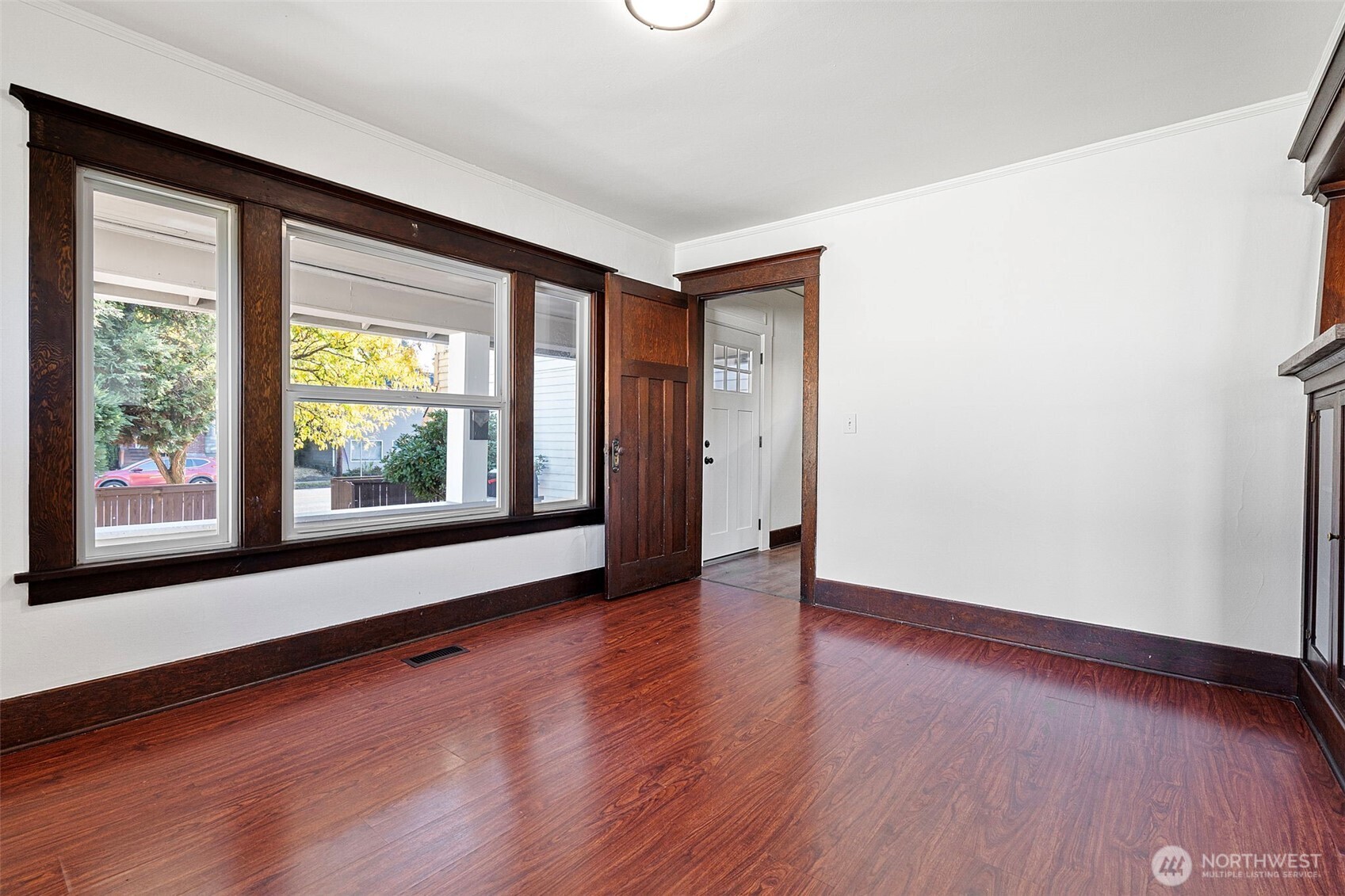 4512 South M Street Tacoma, WA 98418 - Photo 14 of 24 a view of an empty room with wooden floor and a window