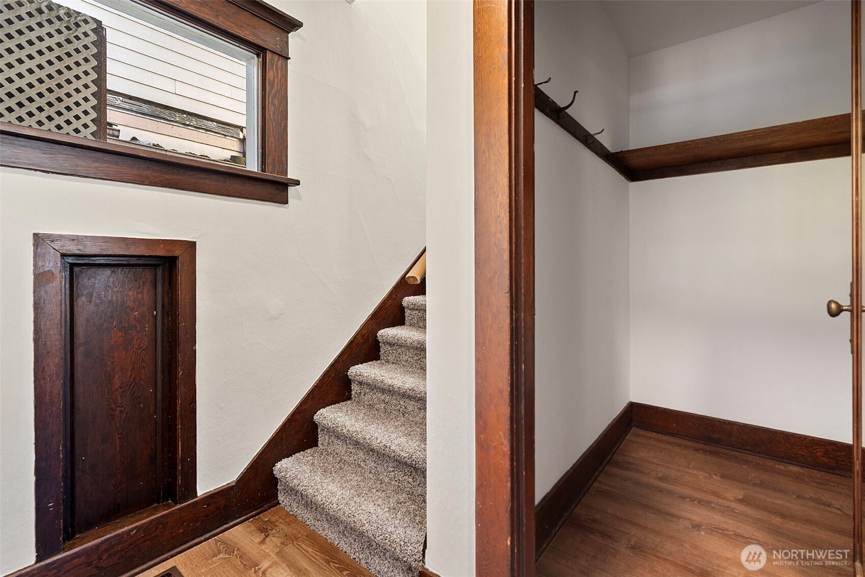 4512 South M Street Tacoma, WA 98418 - Photo 15 of 24 a view of a hallway with wooden floor and staircase
