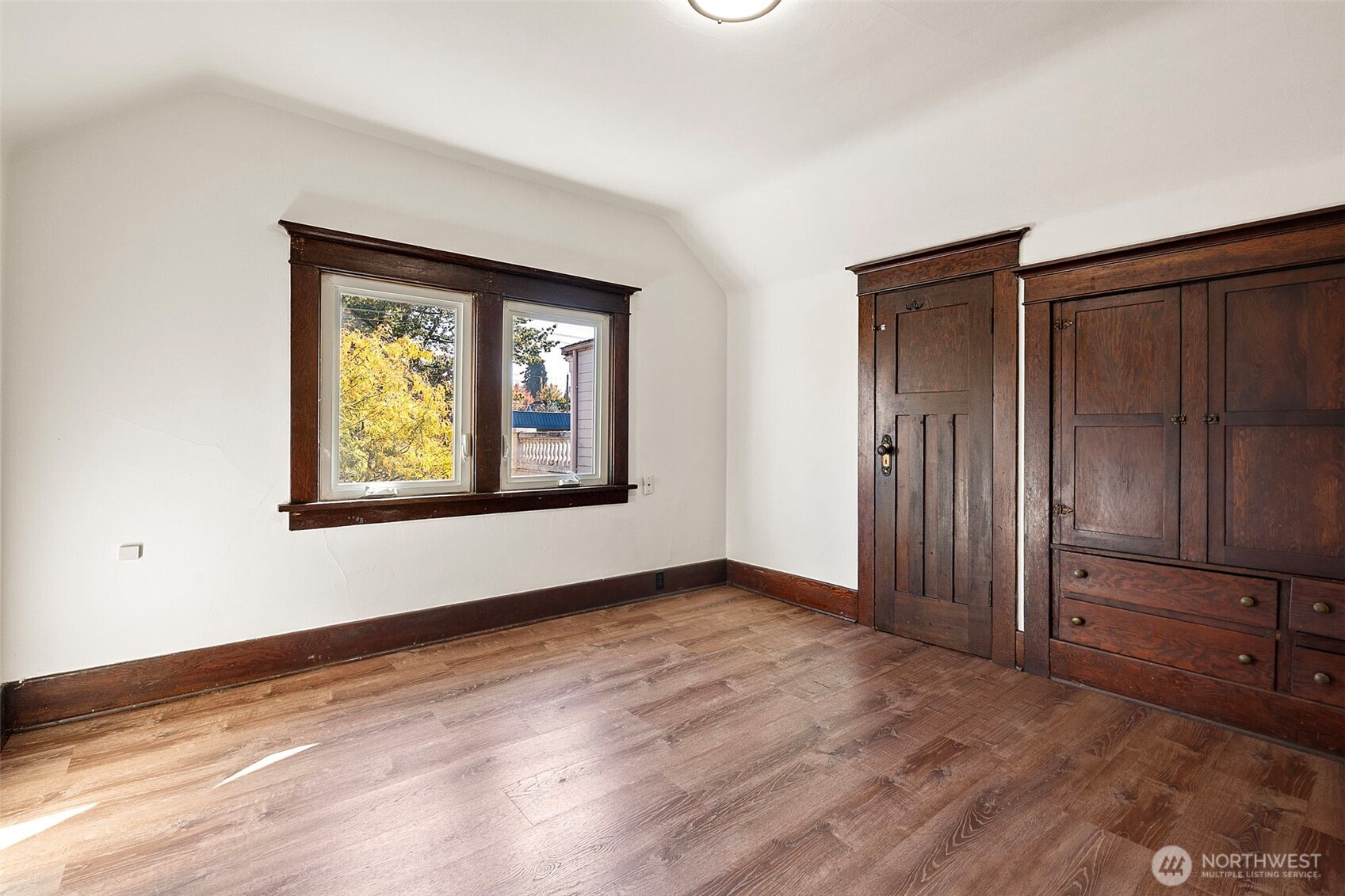 4512 South M Street Tacoma, WA 98418 - Photo 16 of 24 an empty room with wooden floor closet and windows