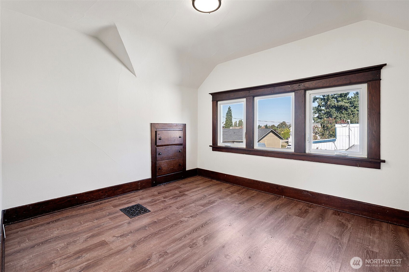 4512 South M Street Tacoma, WA 98418 - Photo 17 of 24 an empty room with wooden floor and windows