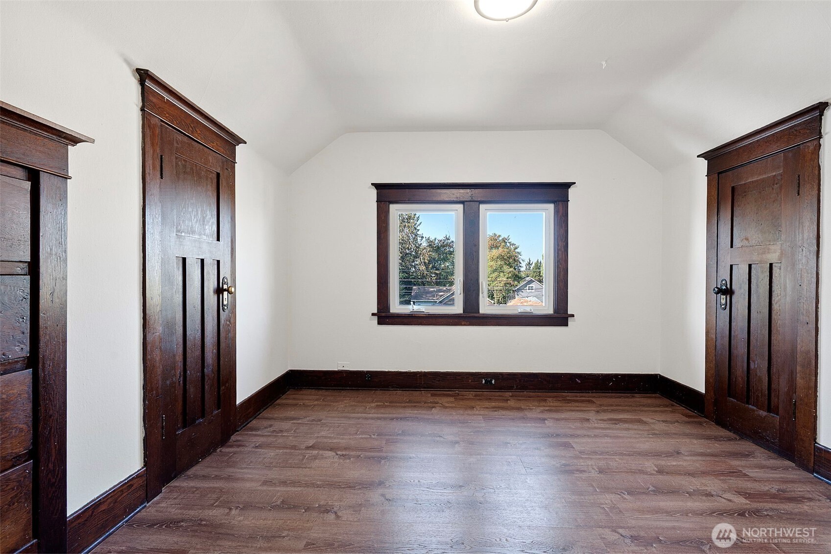4512 South M Street Tacoma, WA 98418 - Photo 19 of 24 an empty room with wooden floor and windows
