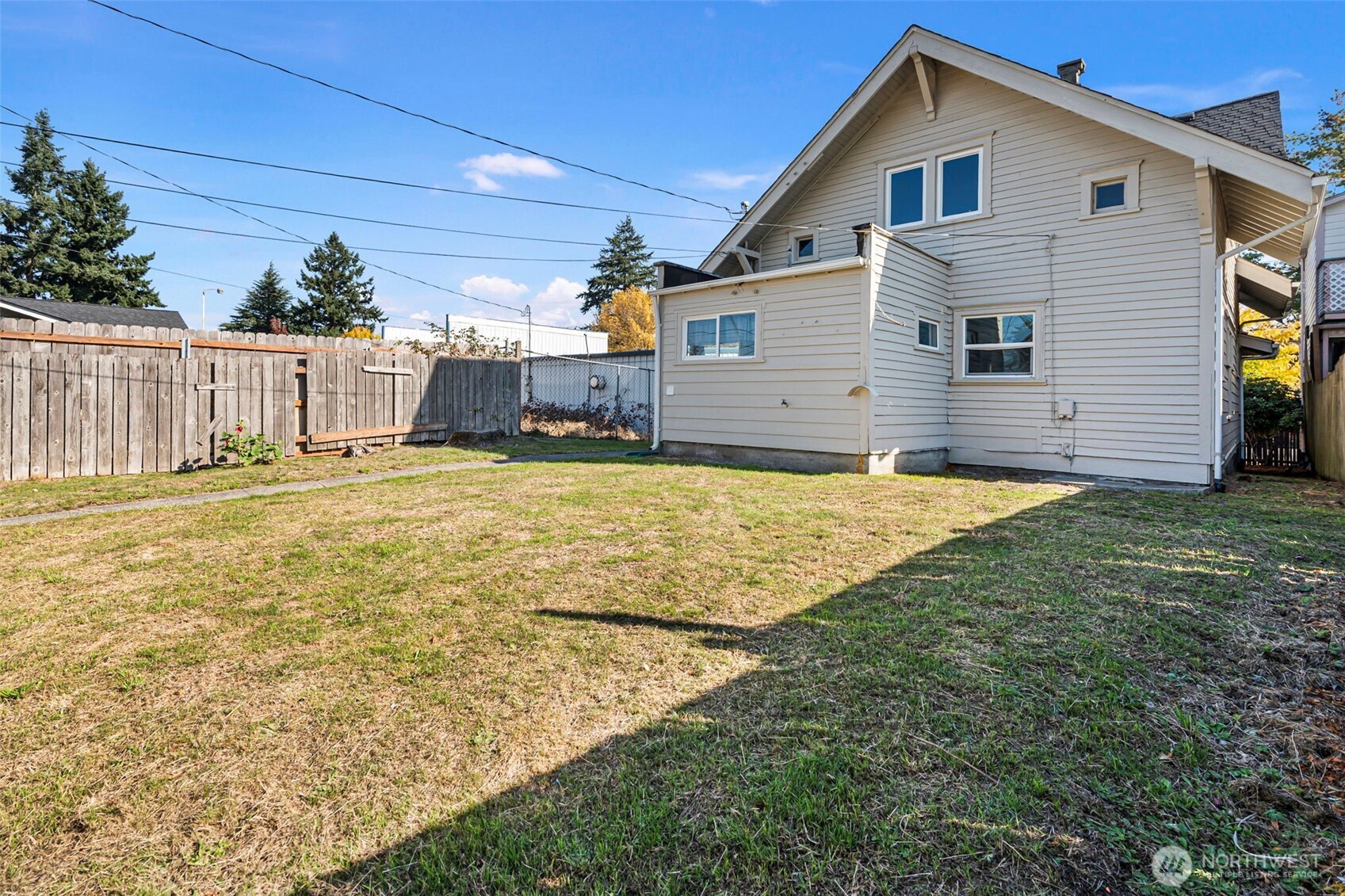 4512 South M Street Tacoma, WA 98418 - Photo 20 of 24 a view of a house with a yard and garage
