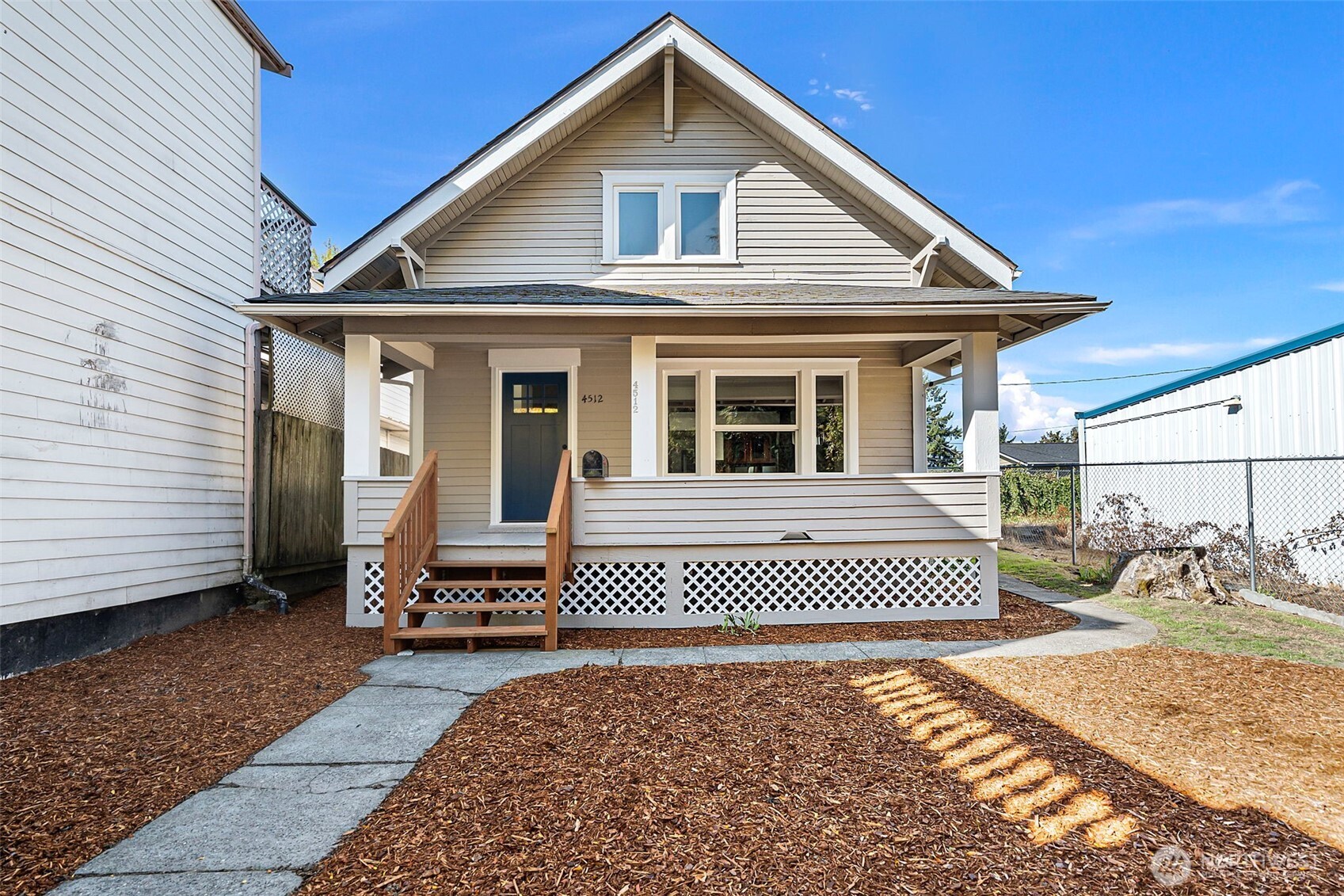 4512 South M Street Tacoma, WA 98418 - Photo 2 of 24 a front view of a house with a yard