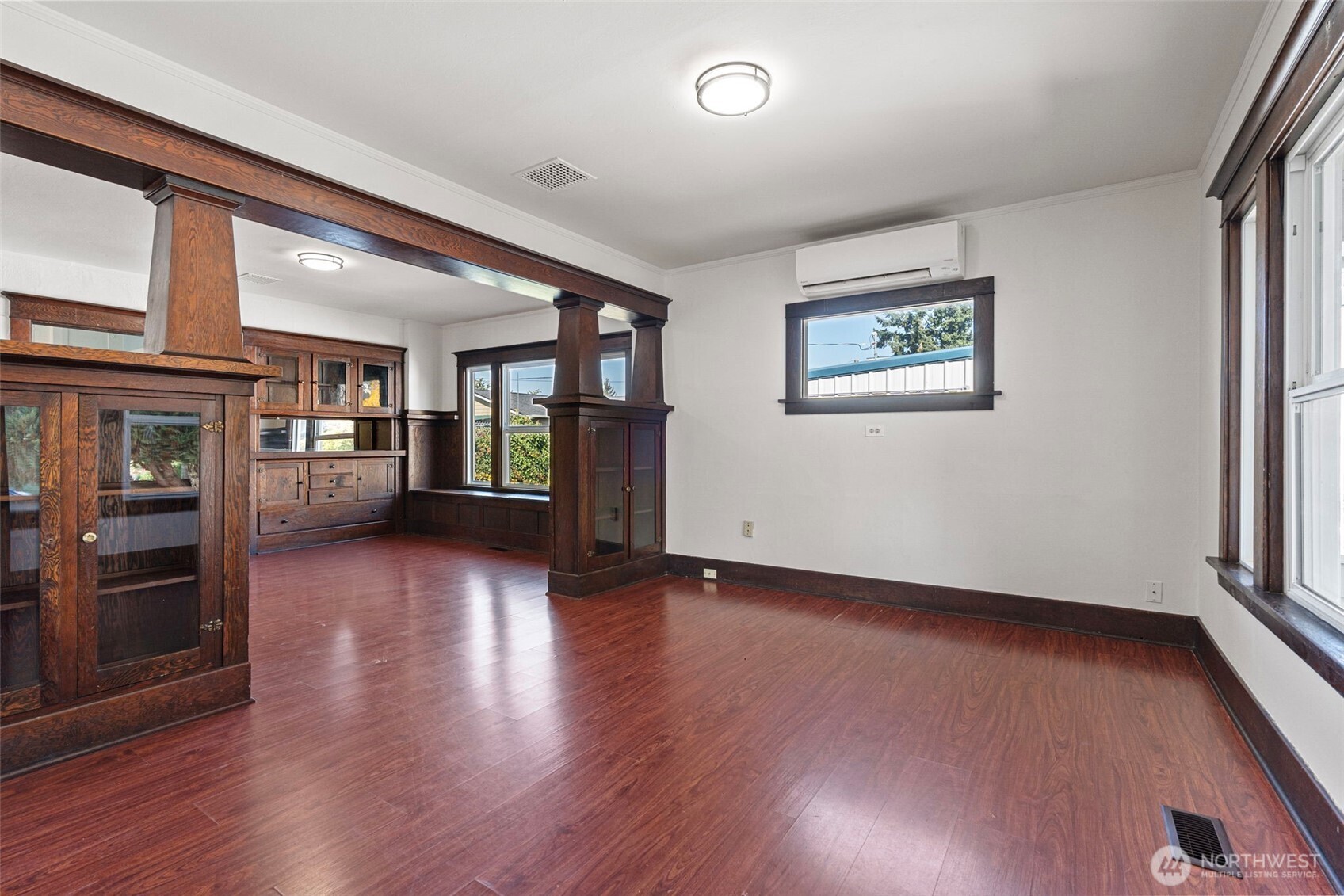 4512 South M Street Tacoma, WA 98418 - Photo 4 of 24 an empty room with wooden floor and windows
