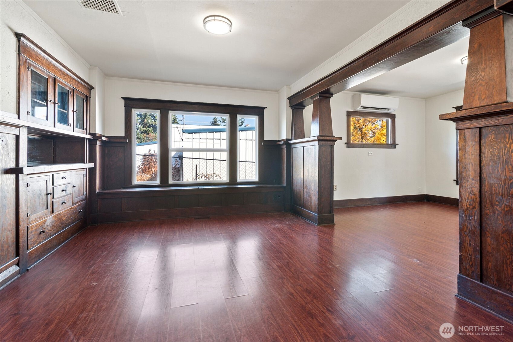 4512 South M Street Tacoma, WA 98418 - Photo 6 of 24 a view of an empty room with wooden floor and a window