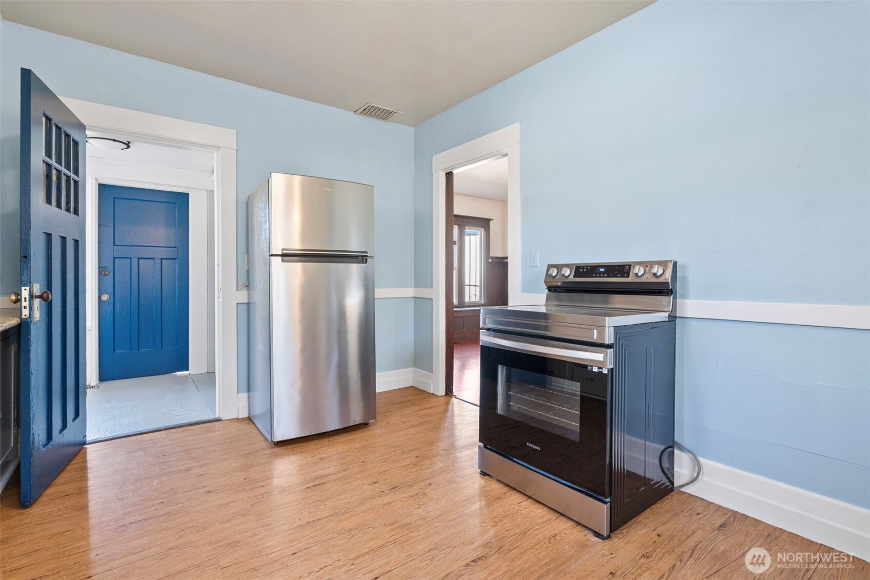 4512 South M Street Tacoma, WA 98418 - Photo 8 of 24 a kitchen with a refrigerator and a stove top oven