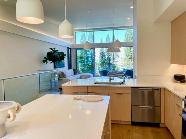 161 Holomoana Way, Unit 102 Kihei, HI 96753 - Photo 11 of 34 a kitchen with a sink and a large window