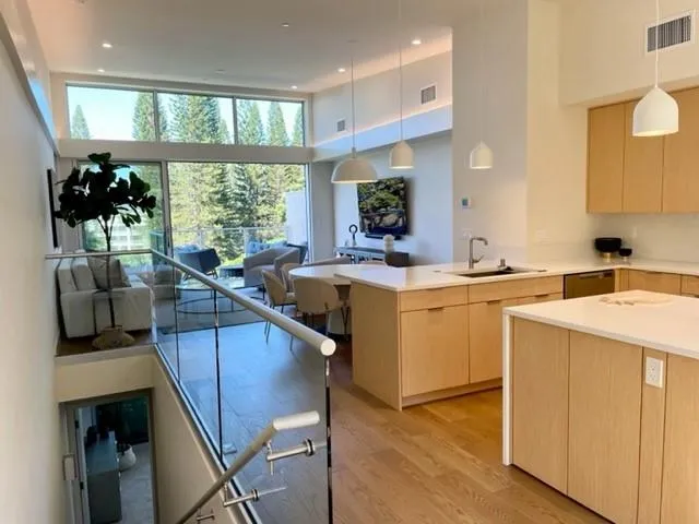 a bedroom with a bed and large window