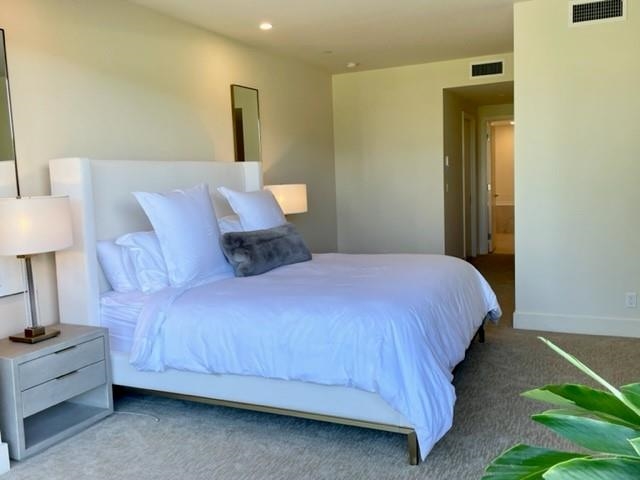 161 Holomoana Way, Unit 102 Kihei, HI 96753 - Photo 22 of 34 a bedroom with a bed and a lamp