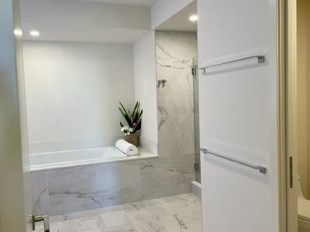 a bathroom with a double vanity sink and mirror