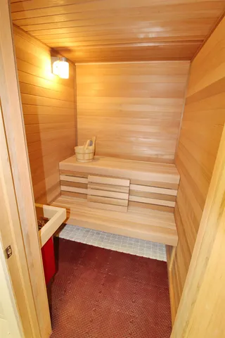 a front view of a house with a tree and a yard