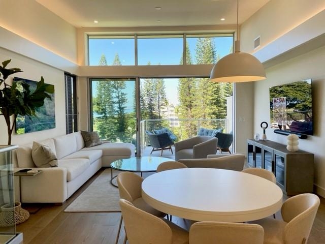 161 Holomoana Way, Unit 102 Kihei, HI 96753 - Photo 34 of 34 a living room with furniture and a large window