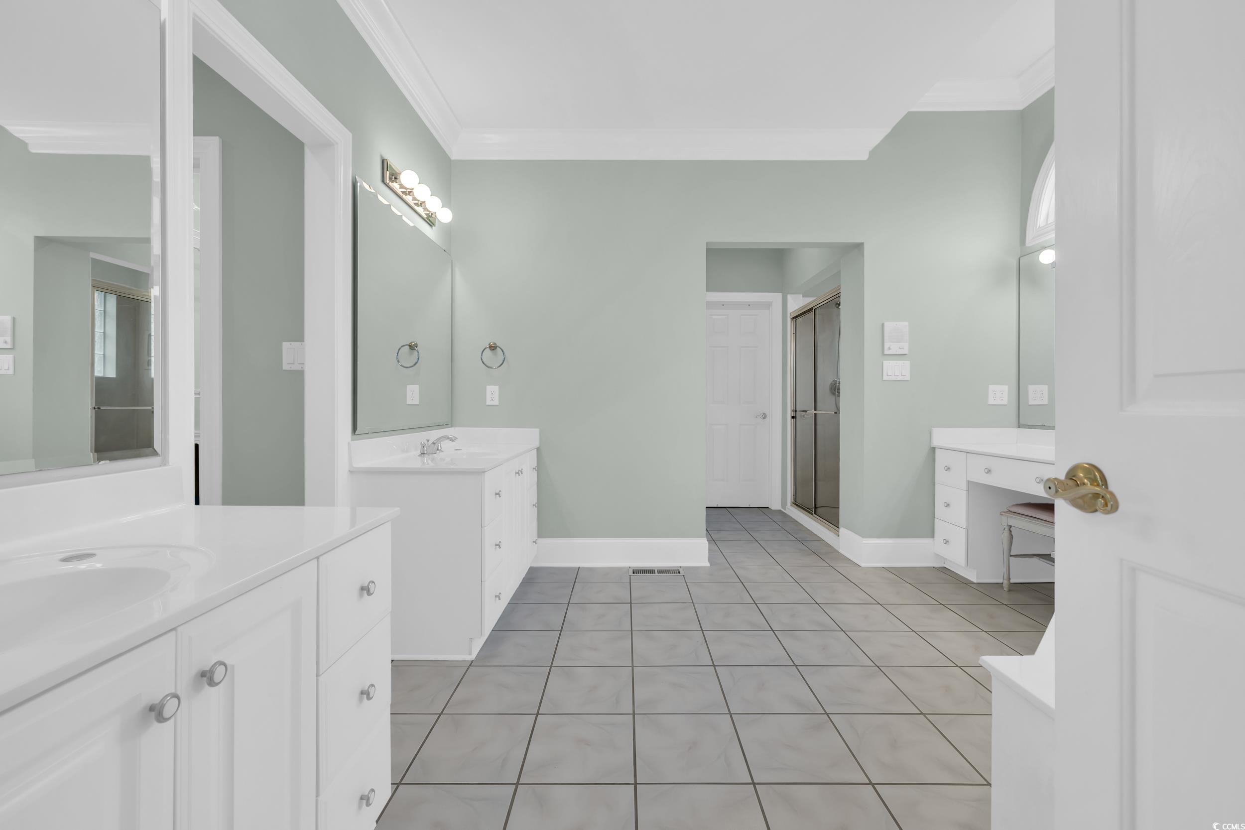 1473 Doar Point Myrtle Beach, SC 29577 - Photo 12 of 40 Bathroom featuring two vanities, a stall shower, tile patterned floors, and crown molding