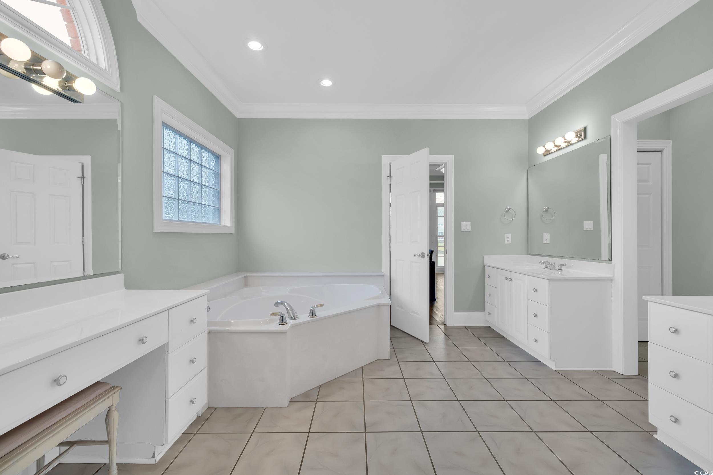 1473 Doar Point Myrtle Beach, SC 29577 - Photo 14 of 40 Full bath with a garden tub, ornamental molding, two vanities, tile patterned floors, and recessed lighting