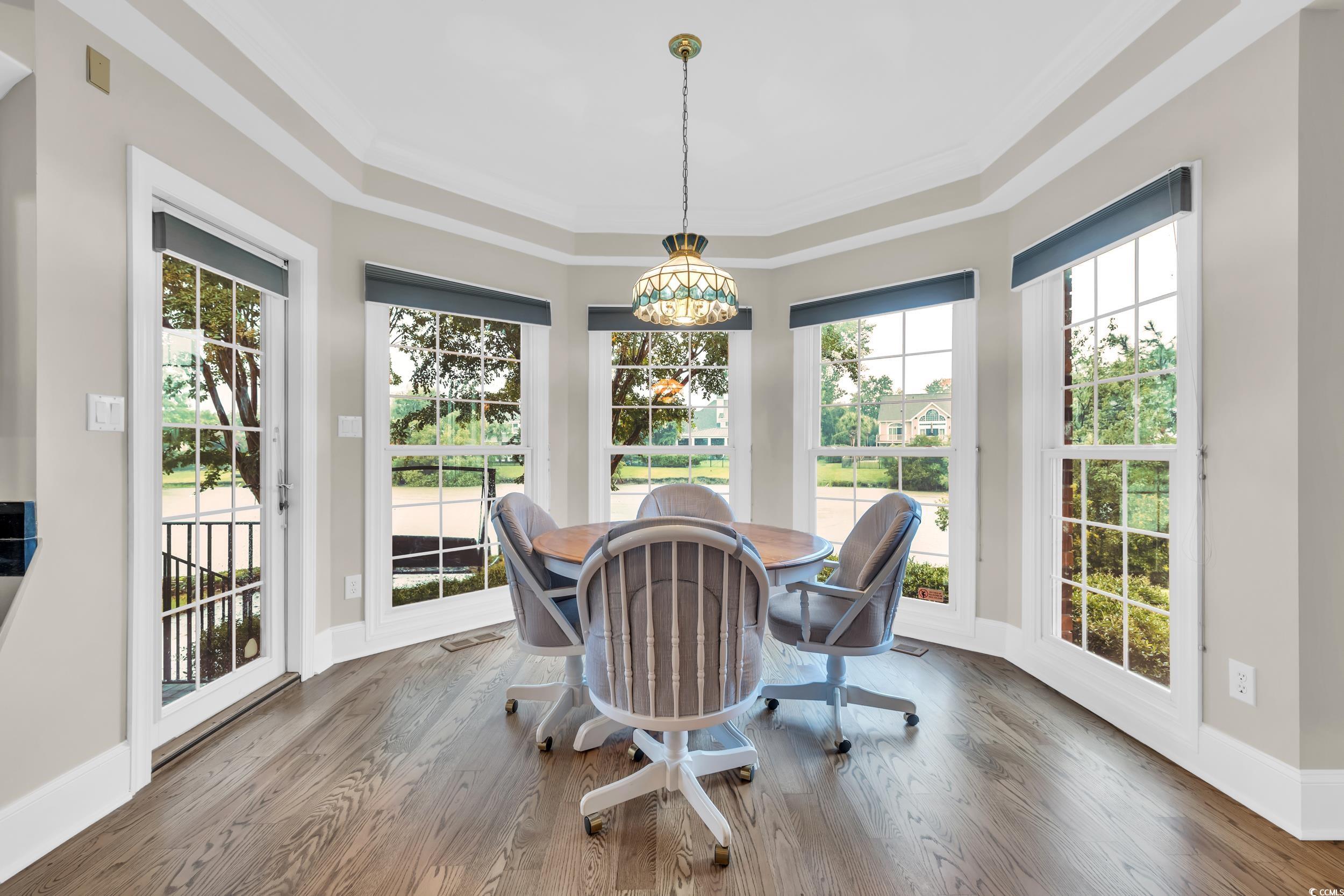 1473 Doar Point Myrtle Beach, SC 29577 - Photo 24 of 40 Dining area featuring plenty of natural light, wood finished floors, and ornamental molding