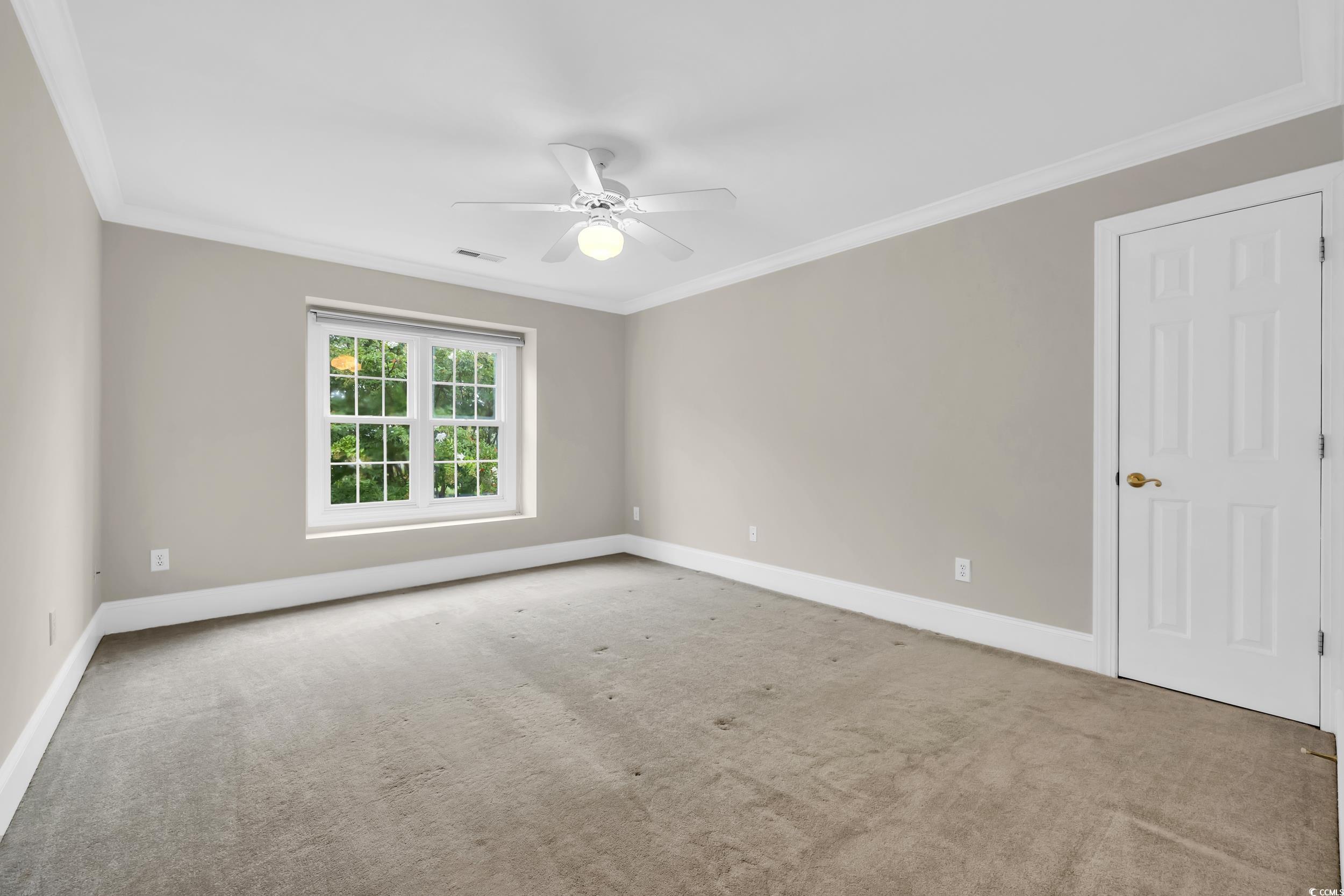 1473 Doar Point Myrtle Beach, SC 29577 - Photo 26 of 40 Carpeted empty room featuring crown molding and ceiling fan