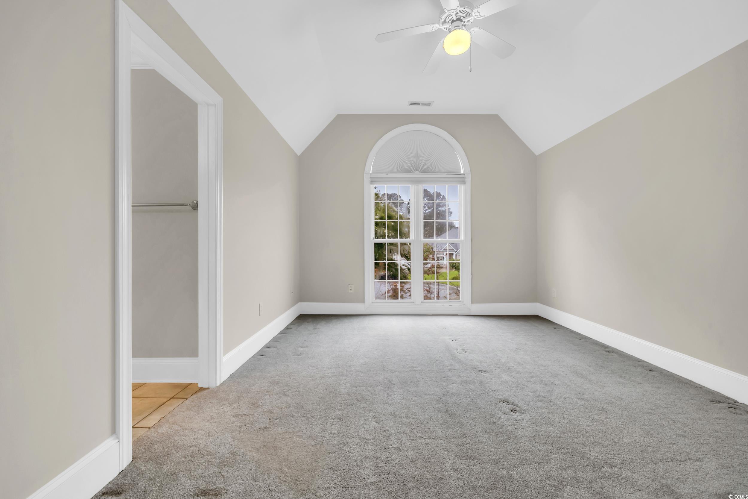 1473 Doar Point Myrtle Beach, SC 29577 - Photo 32 of 40 Unfurnished bedroom featuring carpet flooring, vaulted ceiling, and ceiling fan