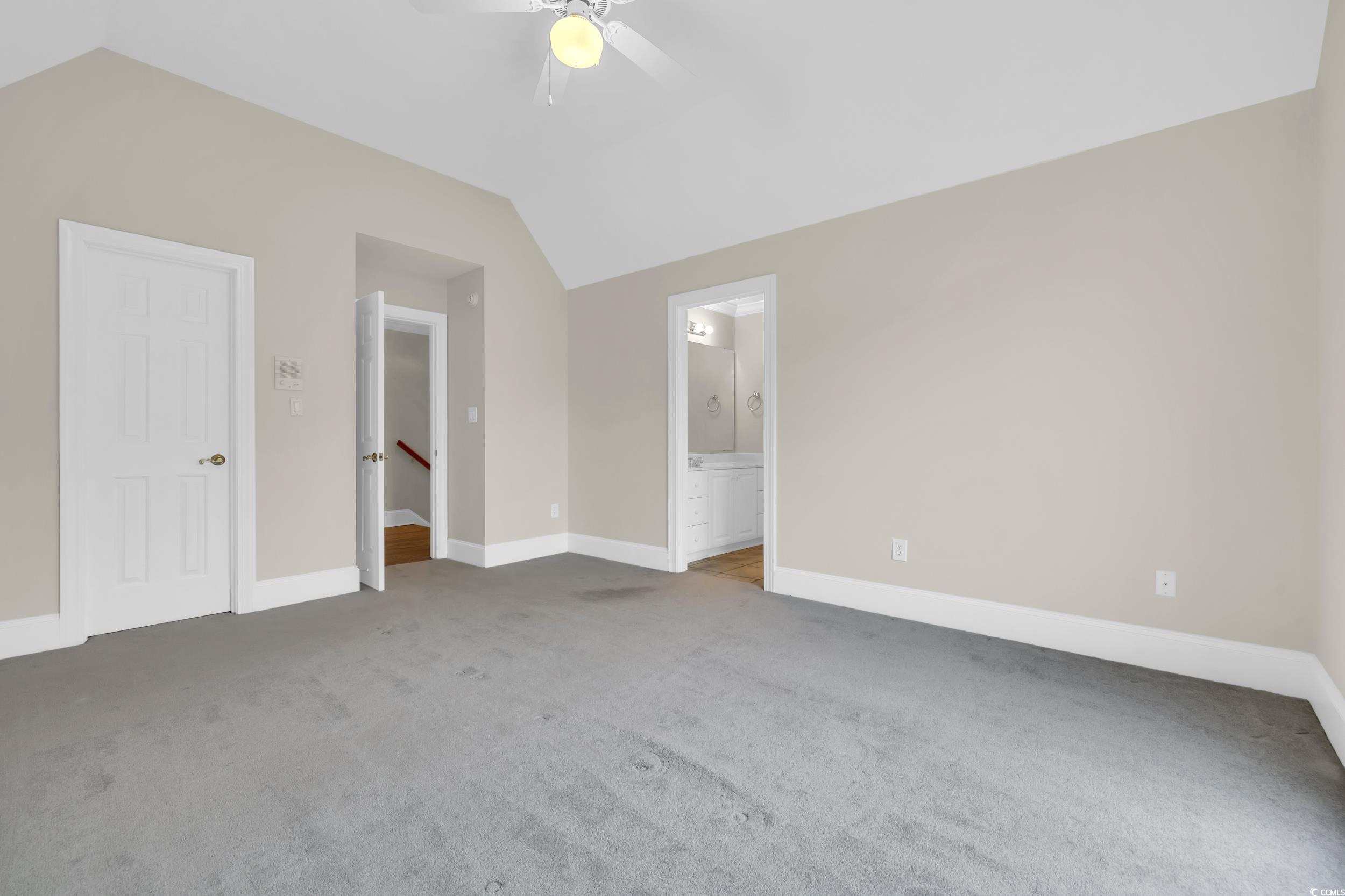 1473 Doar Point Myrtle Beach, SC 29577 - Photo 33 of 40 Unfurnished bedroom with vaulted ceiling, carpet floors, ensuite bathroom, and ceiling fan